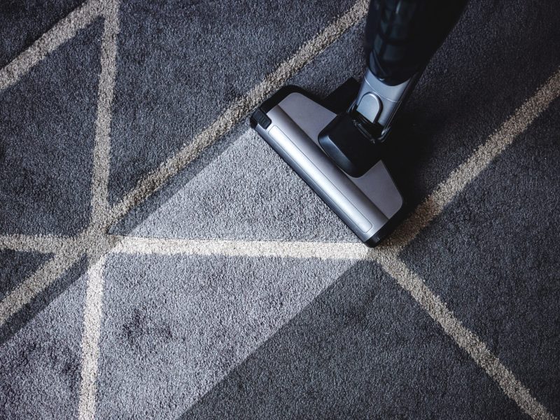 Close up of steam cleaner cleaning very dirty carpet.